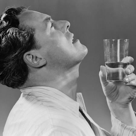 A man gargling water in an old advertisement.