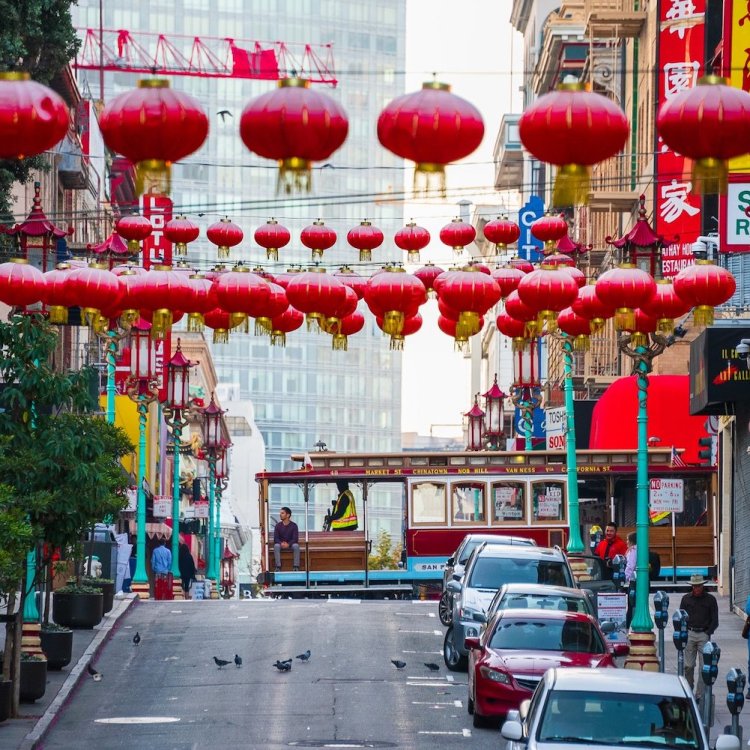 A cable car goes by in San Francisco's Chinatown.