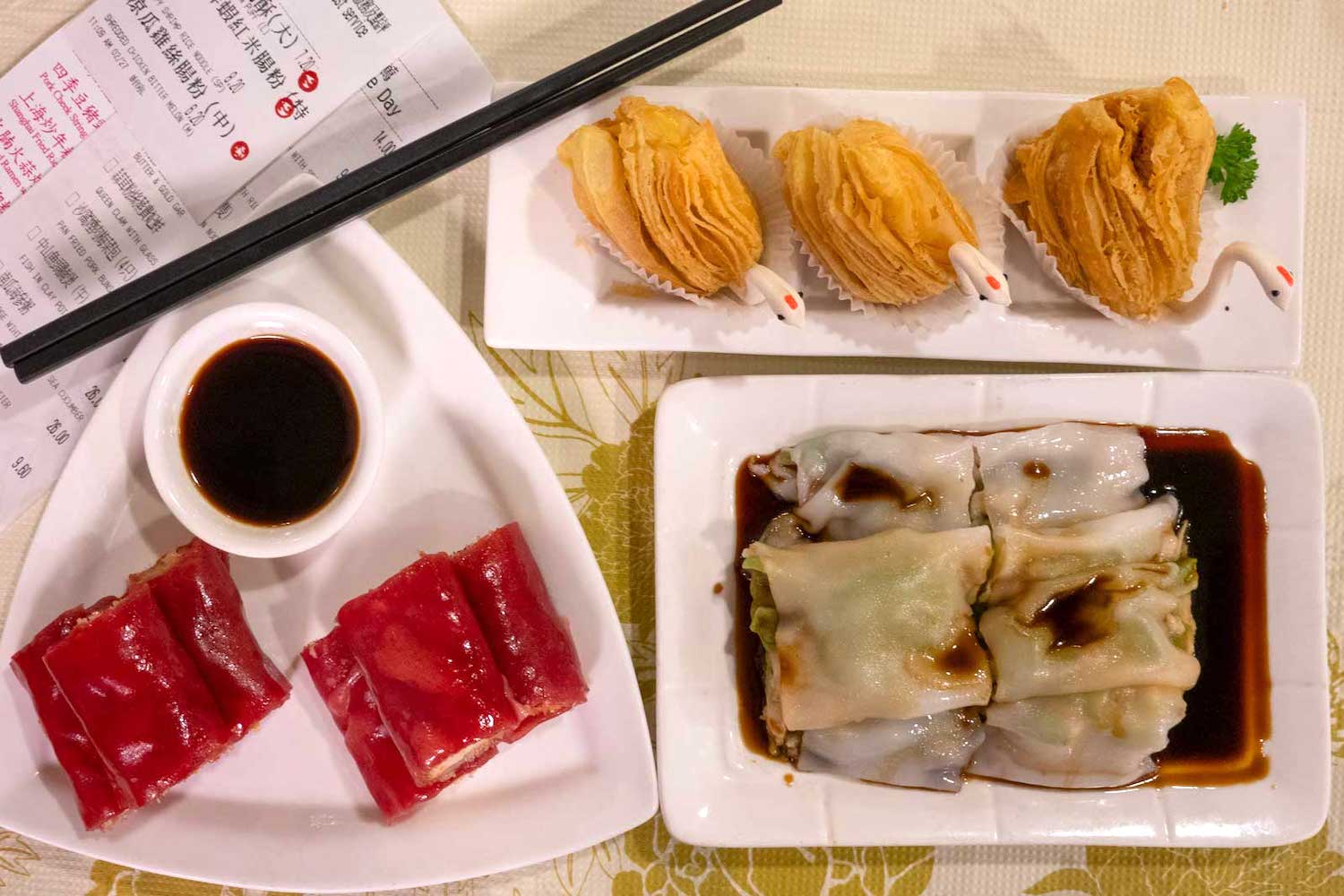 Plates of dim sum, including roasted duck puffs, at Peony Seafood