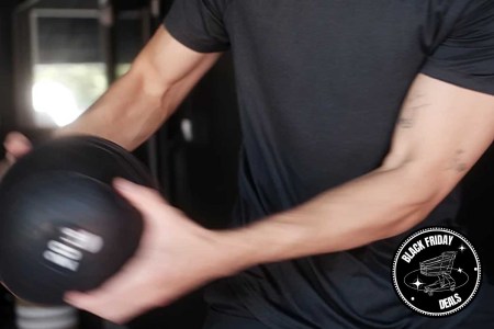 A man working out in Rhone gear.