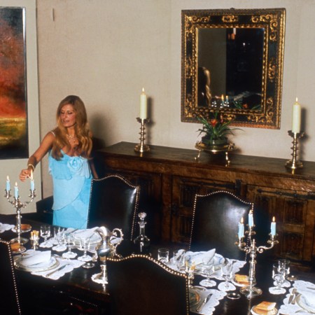 Egyptian-born singer Dalida lights the candles on her dinner table