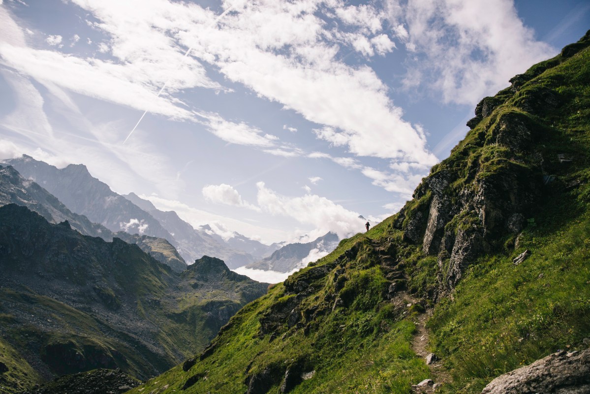 Trail runner Andy Cochrane running a hut-to-hut in the Swiss Alps