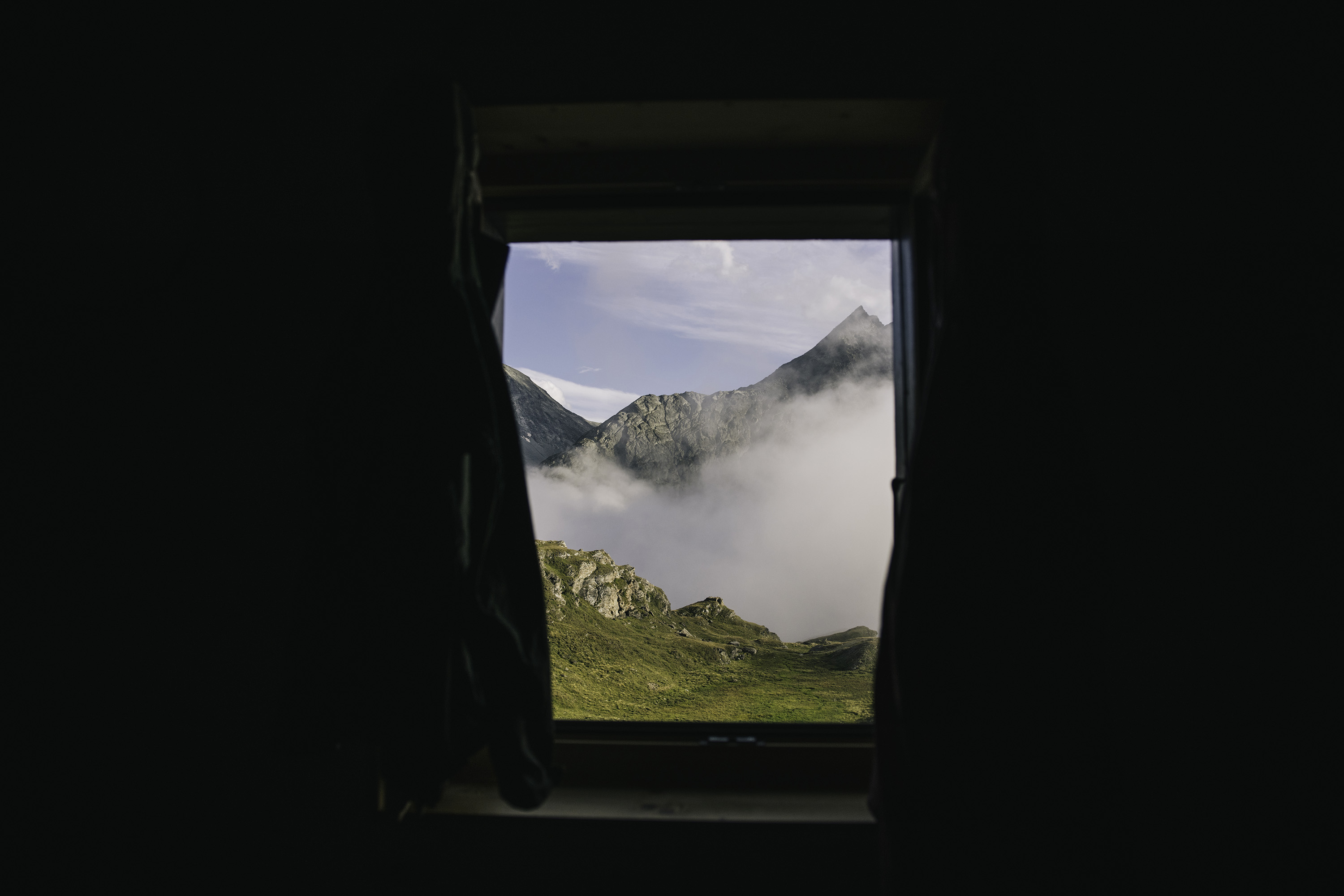 Fog seen through the window of a Swiss hut.