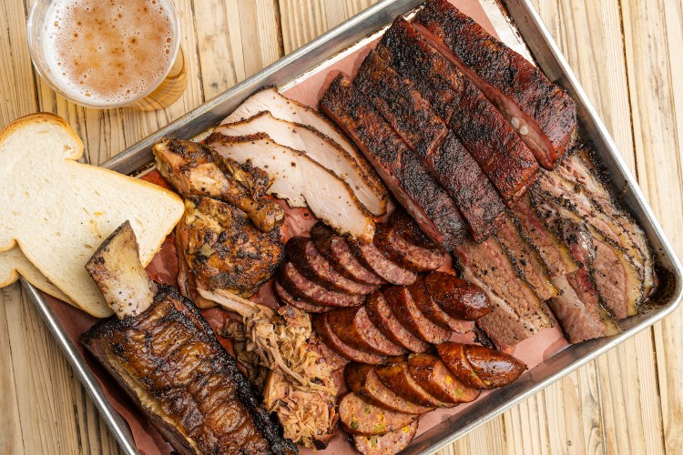 The Pit Room's extensive line-up includes brisket, beef and pork ribs, pulled pork, turkey, chicken, and housemade sausage