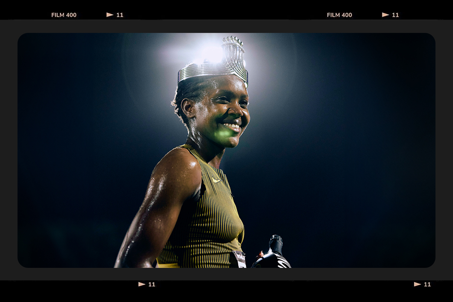 A photo of Faith Kipyegon with a crown on her head. 