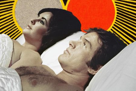 Warren Beatty and Elizabeth Taylor laying in bed in the film The Only Game in Town