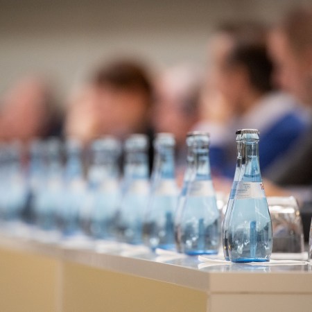 A row of glass water bottles.